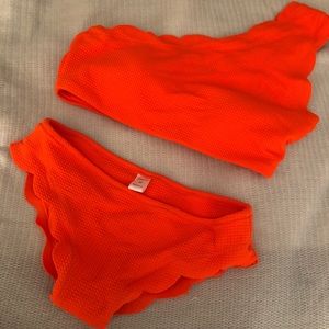 Scalloped, one shoulder bright orange swimsuit